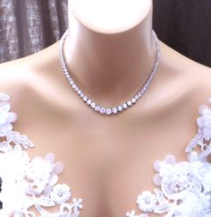 AAA quality clear white cubic zirconia 7mm - 3mm gradation round stones with tarnish resistant high-quality rhodium plated metal setting tennis necklace. Elegant and super flawless sparkling. The necklace measures 15, 16 or 17 inches Available in rose gold and rhodium silver finish. Matching bracelet https://www.etsy.com/listing/85607281/bridal-wedding-bracelet-party-pageant?ref=related-7 Matching earrings https://www.etsy.com/listing/116098279/bridal-earrings-wedding-earrings-bridal?ref=shop_ho Luxury Oval-shaped Halo Necklace, Collar Necklace Choker, Wedding Bridesmaid Jewelry, Flower Choker, Prom Jewelry, Party Necklace, Wedding Bridal Jewellery, Necklace Wedding, Snap Jewelry