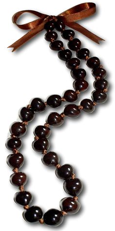 PRICES MAY VARY. 32" inch Mens and Womens Gem Quality Hi-Glossy Genuine Brown Kukui Nuts from the Lumbang Tree Indigenous to the Philippines. Custom Hand Sorted Ideal Select Heart-Shaped Nuts. You Can Determine That These Kukui Nuts are Not Plastic Because each Nut is Unique and Slightly Different. Hand-Crafted in Our Tropical Jewelry Shop by Our Native Island Artisans in the Philippines. American Owned Business Helping Filipino Families. Adjustable Brown Satin Ribbon Tie, Unique Wardrobe Access Kukui Nut Lei, Worry Beads, Tropical Jewelry, Puka Shell Necklace, Kukui Nut, Brown Necklace, Beach Necklaces, Wardrobe Accessories, Chunky Beads