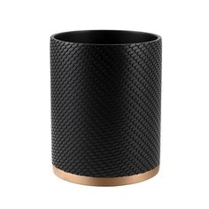 a black and gold vase on a white background