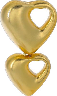 two gold heart shaped pendants on a white background