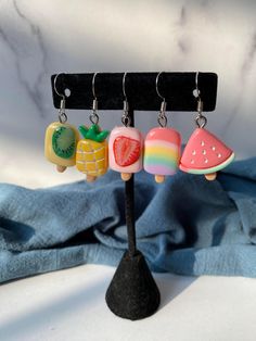 Fruit Dessert Resin Charm Dangle Earrings These beautiful earrings are a variety of fruits as a frozen dessert! Colors may vary slightly due to photo lighting, computer monitor settings, etc. ---------------------------------- Please see my shop policies prior to purchase. http://www.etsy.com/shop/sharonstreasury/policy Sweet Multicolor Handmade Earrings, Multicolor Fruit Design Earrings For Gift, Cute Dangle Earrings With Fruit Design, Trendy Dangle Earrings With Fruit Design, Fruit Dessert, Fits Clothes, Variety Of Fruits, Resin Charms, Photo Lighting