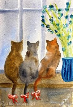 three cats sitting on a window sill looking out the window at flowers in a blue vase