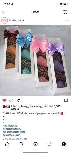 four different types of chocolates in a box with ribbons on the front and side