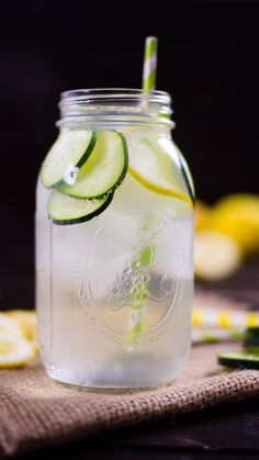 a mason jar filled with cucumber infused water