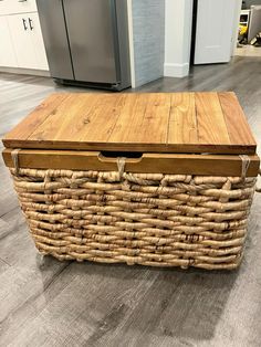 a large wooden box sitting on top of a hard wood floor