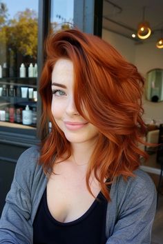 Spice up your look this year and dye your hair a stunning copper color! Don't know what shade to go for? Check out our latest blog post that features over 30 fiery copper hair ideas that are all absolutely gorgeous. From classic copper red hair to rich auburn tones and brilliant ginger shades, you'll find all the inspo you need. Click to view the post now and save your favorites! Hair On Pale Skin, Wild Red Hair, Burnt Copper Hair, Fiery Orange Hair, Medium Red Hair Color, Auburn Orange Hair, Fun Copper Hair Color Ideas, Orange Red Hair Dye, Red Hair Copper