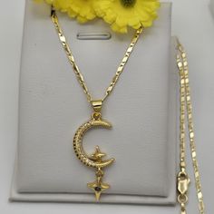 GOLD PLATED JEWELRY Moon with Hanging Stars Pendant & Chain PENDANT 14K Gold Plated Size: 1.5" H (Including bail) *Size Reference: A Quarter Coin is 0.95in / almost 1 inch* CHAIN 14K Gold Plated Length: 17.5 inches U.S. Seller:  Shipping with tracking number. We seek to do the best in our work, if there is any problem, please let us know to fix it ASAP. God bless you! Gold Star Jewelry With Moon Phase Detail, Gold Star-shaped Jewelry With Moon Phase Detail, Gold Moon Phase Star Jewelry, Gold Necklace With Moon Charm And Star Shape, Celestial Gold Plated Necklace With Star Charm, Gold Celestial Dangle Necklaces, Gold Celestial Dangle Necklace, Gold Celestial Pendant Charm Necklaces, Gold Celestial Dangle Charm Necklaces