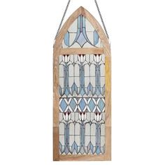 an old stained glass window hanging on a chain