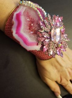 OOAK Wearable Art Cuff. A hot pink, freeform, druzy agate hosts gorgeous freeform pink agate jewel and two rows of aurora borealis rhinestones. Embellishments measure 4.5" x 3.5". The cuff is a faux pink snake print. Cuff has a gold metal interior and edge. Cuff is 4" at the widest point and tapers to narrower curve on your inner forearm. Will best fit wrists up to 7". Rocker Chic Accessories, Pink Snake, Unique Pendant Necklace, Wrist Candy, Statement Choker, Mermaid Necklace, Pink Agate, Druzy Agate, Statement Pendant