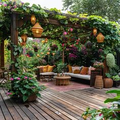 an outdoor living area with lots of plants