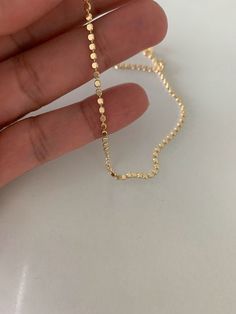 "Gold Flat Beaded Anklet| Dainty Flat Ball Anklet | Beads Chain Anklet | Flat Beaded Chain | Dotted Chain Gold-filled Anklet ---------------------------------------------------------------------------------------------------- ♦ Materials: 14K Gold Filled ♦ Available Colors: Gold ♦ Necklace Measurements: 9.5\" or 9.5\" with 2\" extender ♦ Beads Measurements: 2mm wide ------------------------------------------------------------------------------------------------- MATERIALS All chains are made of Anklet Beads, Bracelet Measurements, Beaded Anklet, Bracelet Minimalist, Beads Chain, Gold Flats, Bridesmaid Bracelet, Beaded Anklets, Bridal Bracelet