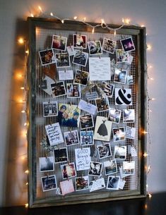 a bulletin board with pictures and lights on it