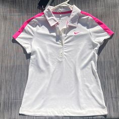 Nike Girls Golf Dri Fit Short Sleeve White And Magenta Shirt Beat The Heat On The Course With This Brand New Nike Dri-Fit Golf Shirt For Girls (Size Medium). This White And Magenta Top Features Nike's Dri-Fit Technology That Wicks Away Sweat To Keep Her Dry And Comfortable. Plus, It's Lightweight And Breathable For All-Day Wear. (New With Tags) Nike Collared Tops For Spring, Pink Sporty Collared Top, Sporty Pink Collared Top, White Nike Tops For Spring, Spring Sports Collared Tops, White Sports Shirt For Spring, Spring Sports White Shirt, Fitted White Sports Shirt, Sporty White Collared Tops