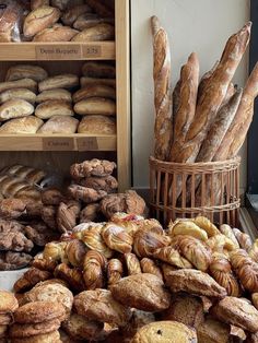 breads and pastries on display in a bakery