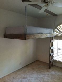 a bedroom with a bunk bed and ceiling fan