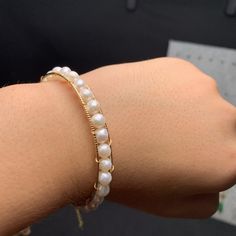 This beautiful Freshwater pearl bracelet ranges between 5-6mm in size and consists of beautiful and lustrous pearls in AAAA+ quality. All pearls in this bracelet are round and are strung with silk thread and double-knotted between each pearl. Known as the 'icon' of cultured pearls, Freshwater pearls have graced the necks, ears, fingers, and wrists of women for decades. Huge Tomato imports their Freshwater pearls from the Freshwater rs of Japan, grown in the Pinctada fucata oyster. All of our Fre 14k Gold-filled Pearl Bracelet, Elegant Gold-tone Pearl Bracelet, 14k Gold-filled Pearl Bracelet With Round Beads, 14k Gold-filled Hypoallergenic Pearl Bracelet Gift, Elegant Pearl Jewelry, Adjustable 14k Gold-filled Elegant Pearl Bracelet, Pearl Bangle Bracelet, Freshwater Pearl Jewelry, Pearl Bangle