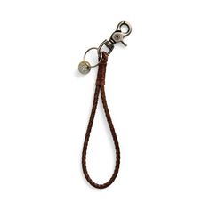 a keychain with a metal hook attached to it's end and a brown cord