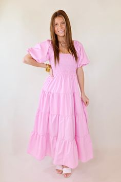 Make a statement in the Santorini Sunshine Short Balloon Sleeve Maxi Dress. This beautiful light pink dress features a smocked bodice with short balloon sleeves and a tiered skirt for a timeless look. Exuding effortless elegance, this dress is perfect for any special occasion. Arté is wearing a size small. Size Measurements: Small: 2-6 | Bust: 15 inches across the front (smocked, stretches) | Length: 50 inches Medium: 8-10 | Bust: 16 inches across the front (smocked, stretches) | Length: 51 inch Short Balloon Sleeves, Cute Church Outfits, Modest Summer Dresses, Causal Dresses, Mismatched Bridesmaid Dresses, Light Pink Dress, Pink Bridesmaid Dresses, School Dresses, Cute Preppy Outfits