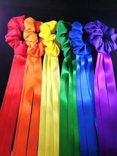 six different colors of satin ribbons in a row