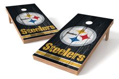 two wooden cornhole boards with the pittsburgh football team on each side and one is black, white, and gold