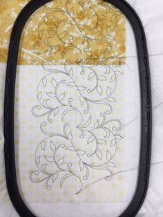 a piece of fabric that has been stitched into the side of a quilter's frame