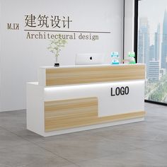 the front desk of an architectural design firm in hong kong, with cityscape behind it