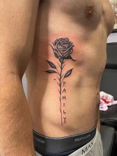 a man with a rose tattoo on his chest and the word family written in black ink