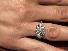 "The item is a sterling silver filigree diamond ring. The ring weighs 2.6 grams and is a finger size 7. The top part of the ring measures 11 millimeters wide and the bottom part of the ring measures 2 millimeters wide. The seven diamonds weigh .05 carats. The diamonds are a \"G\" color and \"SI2\" clarity. I can adjust the size on it . I will provide a ring box with the ring." Filigree Diamond Ring, Silver Diamond Ring, Hot Jewelry, Sterling Silver Filigree, Wedding Rings Unique, Lovely Ring, Classic Jewelry, Silver Filigree, Silver Diamonds