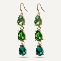 Make a statement with these green emerald crystal earrings. Perfect for adding a little extra colour to a plain outfit. Features cool hues in a modern geometric cut shape. Pair with another piece in our Iris range for ultimate sparkle. Gold-Tone Plated Product Code: DE1173C Collection: Iris Type: Hook Material: Base Alloy & Crystal Dimensions: Pendant Dimensions: Style: Contemporary, Statement, & Geometric Includes: Luxury Green Earrings For Formal Occasions, Luxury Green Bridal Earrings For Formal Occasions, Luxury Green Bridal Earrings For Celebration, Luxury Green Bridal Earrings For Reception, Luxury Green Chandelier Earrings For Formal Occasions, Luxury Green Hoop Earrings For Formal Events, Luxury Green Bridal Earrings With Stone Work, Luxury Green Bridal Earrings For Festive Occasions, Traditional Green Bridal Earrings Luxury