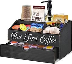 a wooden box filled with coffee and condiments