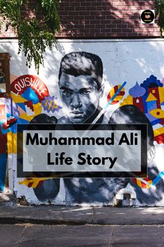 a mural on the side of a building that says muhamad ali life story