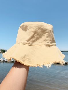 Beige, blue, and yellow. Casual Yellow Wide Brim Hat, Casual Yellow Bucket Hat For Beach, Yellow Summer Bucket Hat For Spring, Yellow Cotton Summer Bucket Hat, Trendy Bucket Sun Hat For Summer, Yellow Summer Cotton Bucket Hat, Casual Yellow Sun Hat, Casual Yellow Hat For Spring, Casual Yellow Cotton Sun Hat