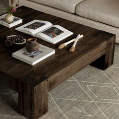 a coffee table with two books on it