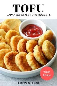 japanese style tofu nuggets in a bowl with ketchup on the side