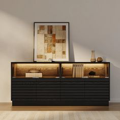 a black cabinet with drawers and books on top in a room next to a white wall