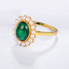 This beautiful ring feature a oval emerald with pearl , sure to add a splash of color to any look. Features This ring in sterling silver has a classic and luxurious design that is perfect for any occasion. Made all by hand! It truly deserves a spot in every jewelry collection. Beautifully crafted, this style is sure to become a treasured keepsake. It is made of 925 sterling silver. Made to last a lifetime, strong and durable! Strict health standards guarantee your everyday wearing. Lead-free, ca Elegant Emerald Ring With Oval Cabochon, Elegant Opal Oval Cabochon Ring Gift, Elegant Opal Ring With Oval Cabochon, Elegant Oval Cabochon Opal Ring Gift, Elegant Green Emerald Cabochon Ring, Elegant Green Cabochon Emerald Ring, Elegant Green Opal Oval Ring, Elegant Green Pearl Ring With Gemstone, Elegant Gold Opal Ring For May Birthstone