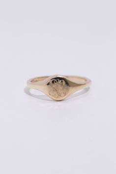 A classic hand engraved monogram ring. Solid 14k recycled gold. Signet face is 7.8mm round, and tapers to a 2.2mm band. 1-2 letters of your choosing engraved into the face. If you would like diamonds or other small birthstones inlaid into the ring, contact us here with the special request. This ring is made to order, please allow 3-4 weeks for delivery. Personalized Engraved 14k Gold Ring, Personalized Classic Diamond Promise Ring, Elegant 14k Gold Engraved Initials Ring, Wedding 14k Gold Signet Ring With Round Cut, 14k Gold Engraved Ring For Anniversary, Elegant Round Engraved Ring With Engraving Option, Timeless Engraved Ring In Recycled Gold As Gift, Personalized Initial Ring In 14k Gold With Round Band, Timeless Engraved Ring In Recycled Gold