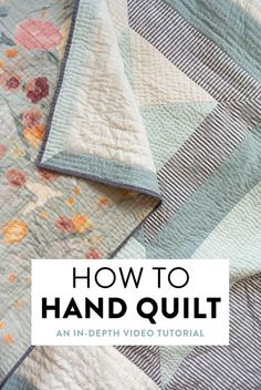 a quilt with the words how to hand quilt an in - depth video guide on it