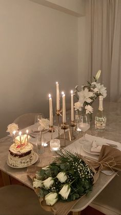 a table with candles and flowers on it