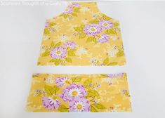 two pieces of yellow fabric with pink flowers on them