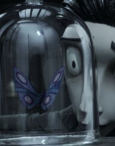 an animated character under a clochet with a butterfly on it's face