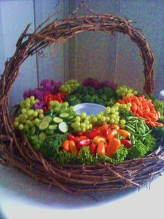 a basket filled with vegetables sitting on top of a table