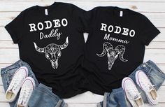 These matching family shirts are the perfect shirts for the family at the rodeo! HOW TO ORDER more than one: click the dropdown tab and click on a size. Click the next dropdown tab to choose your shirt and add to cart. Go back to the listing and choose another size. Choose your quote. Click add to cart. When you click on your cart, both shirts will be there. Repeat for more. Feel free to message me with any questions! This t-shirt is everything you've dreamed of and more. It feels soft and light Custom Print Black Top For Family Gatherings, Black Custom Print Top For Family Gatherings, Black Tops With Custom Print For Family Gatherings, Black Graphic Print T-shirt For Family Gatherings, Black Tops With Graphic Print For Family Events, Black T-shirt With Custom Print For Family Events, Black Short Sleeve Top For Family Gatherings, Black T-shirt With Name Print For Family Events, Family Matching Black Shirt For Family Reunion