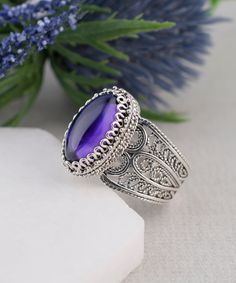 925 Sterling Silver Genuine Authentic Purple Artisan Crafted Filigree Oval Cocktail Statement Ring Boxed Women Jewelry Gifts Boxed for Her Material: 925 Solid Sterling Silver Genuine Amethyst Gemstone Dimensions : 14 mm x 7 mm, Oval, Cabochon, Approximate Total Carat Weight: 3.4 Ring Face Length: 0.65 inches   Ring Face width: 0.40 inches This will come in a designer pouch & gift box with  a romance card Free Domestic Shipping  It is a gift that will create memories for years to come. Our fine s Cocktail Jewelry, Filigree Jewelry, Fine Silver Jewelry, Sterling Silver Filigree, Amethyst Gemstone, Buying Jewelry, Handmade Artisan, Jewelry Gift Box, Purple Amethyst