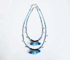 Spice up your Summer with unique tassel necklace in blue shades, with a carefree bohemian vibe. Made with Turquoise and Marble stones, navy blue ruberized beads, silver plated star charms, glass beads and tiny handmade cotton tassels. ►Pick between four lengths, wear two necklaces for a statement layered look or a single strand as an accent. ►Length Options: 18/20/25/27inches. Modeled necklaces are: Short necklace is 18 inches long (45cm). The longer necklace is 25 inches long (63cm). Message me Blue Bohemian Beaded Necklaces For Summer, Bohemian Blue Beaded Necklaces For Summer, Adjustable Fringe Necklace For Beach, Bohemian Beach Tassel Necklace With Fringe, Bohemian Beaded Necklaces With Tassels For The Beach, Adjustable Turquoise Tassel Necklaces, Turquoise Tassel Necklaces For Festivals, Bohemian Turquoise Necklaces With Tassels, Bohemian Turquoise Tassel Necklace (adjustable)