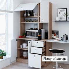 the kitchen is clean and ready to be used as a storage area for coffee or tea