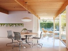 a dining room table with four chairs around it