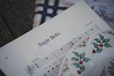 an open sheet of music with the words jungle bells written in black and white on it