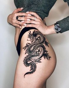 a woman with a tattoo on her thigh