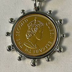 a key chain with a coin on it